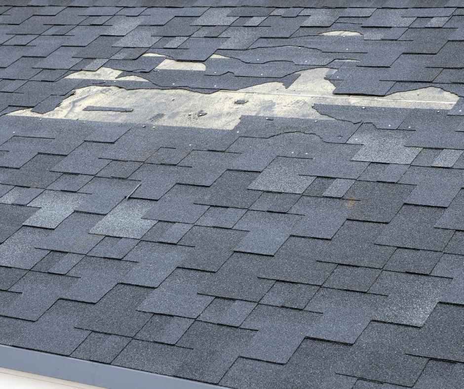 broken shingles on roof