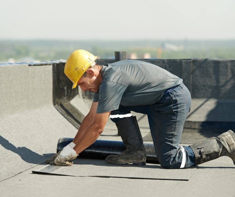 roofer installing shingles