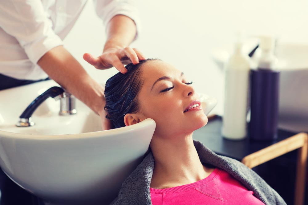 Woman Having Her Hair Washed — Hair Salon in Sippy Downs, QLD