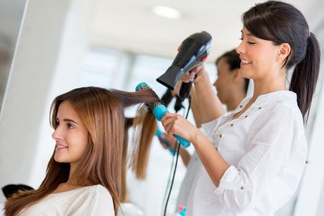 Stylist Blow-Drying Hair — Hair Salon in Sippy Downs, QLD