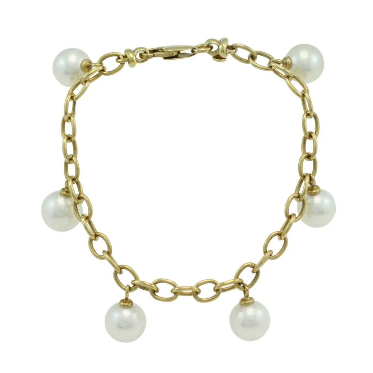A gold link bracelet featuring five evenly spaced, round white pearls as charms.