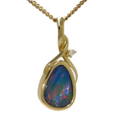Gold teardrop pendant featuring a dark blue opal and a small clear stone on a gold chain.