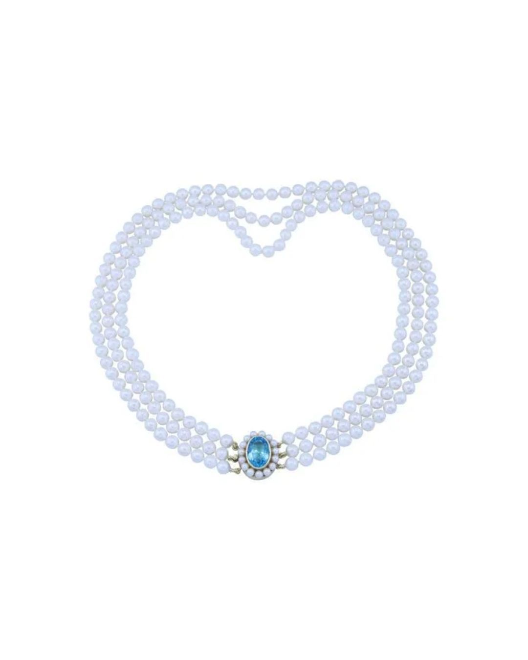 A three-strand white pearl necklace featuring a central oval blue gemstone clasp surrounded by smaller pearls.