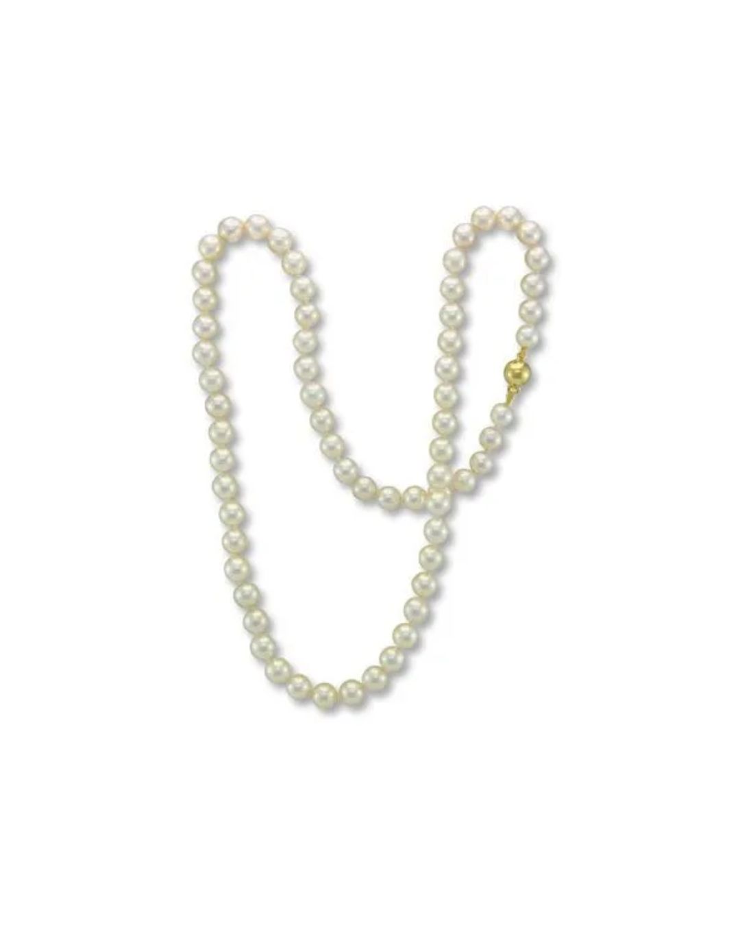A classic, single-strand white pearl necklace with a polished gold clasp against a plain white background.