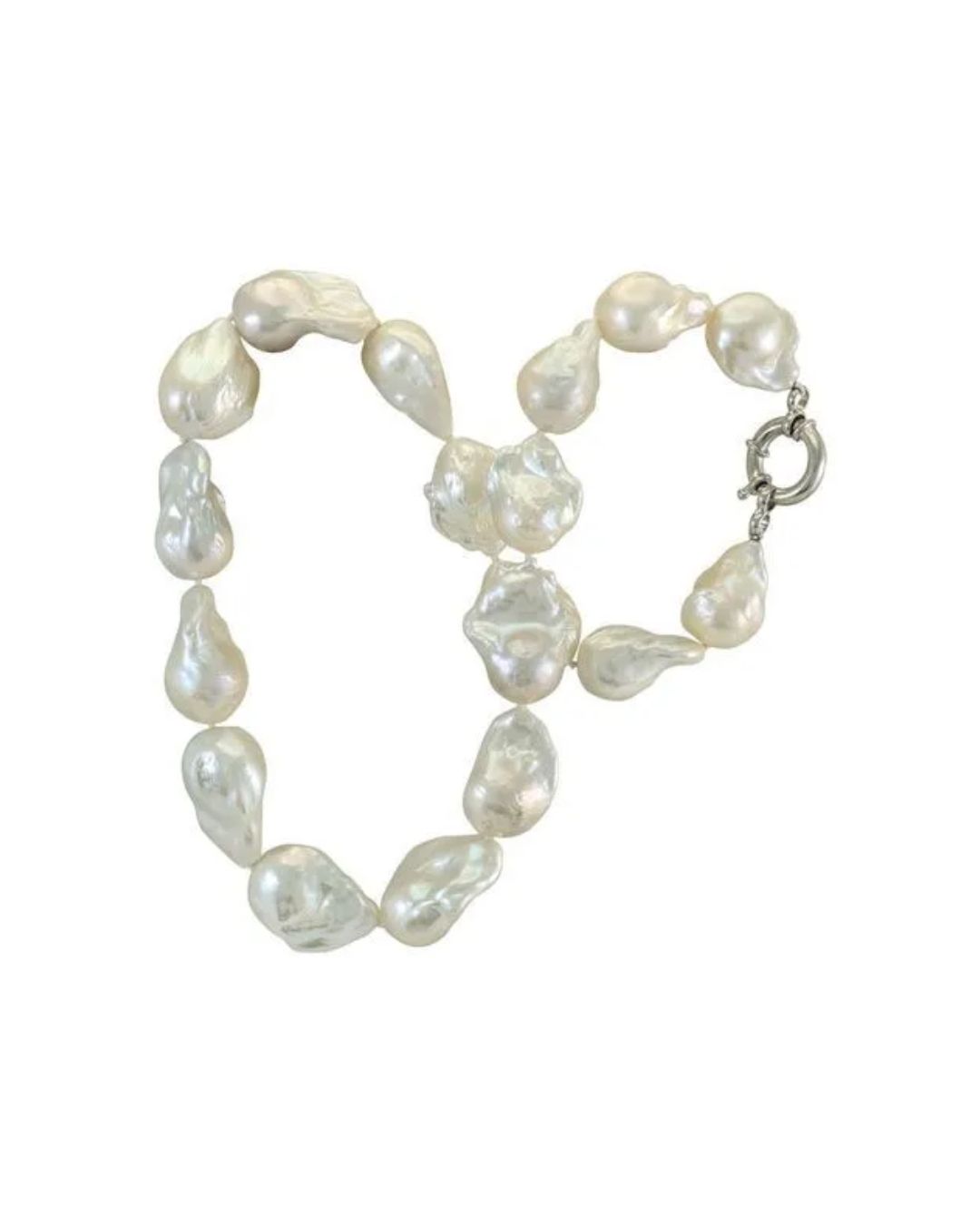 A strand of white, irregularly shaped baroque pearl beads with a silver toggle clasp against a plain white background.