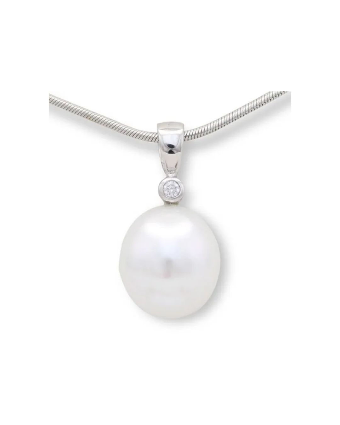A white pearl pendant featuring a small round diamond accent on a silver chain necklace.