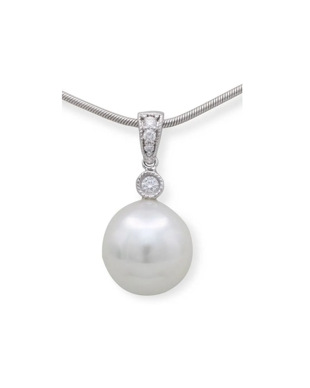 A silver pendant necklace featuring a large, round white pearl topped with a small diamond-studded silver bail.
