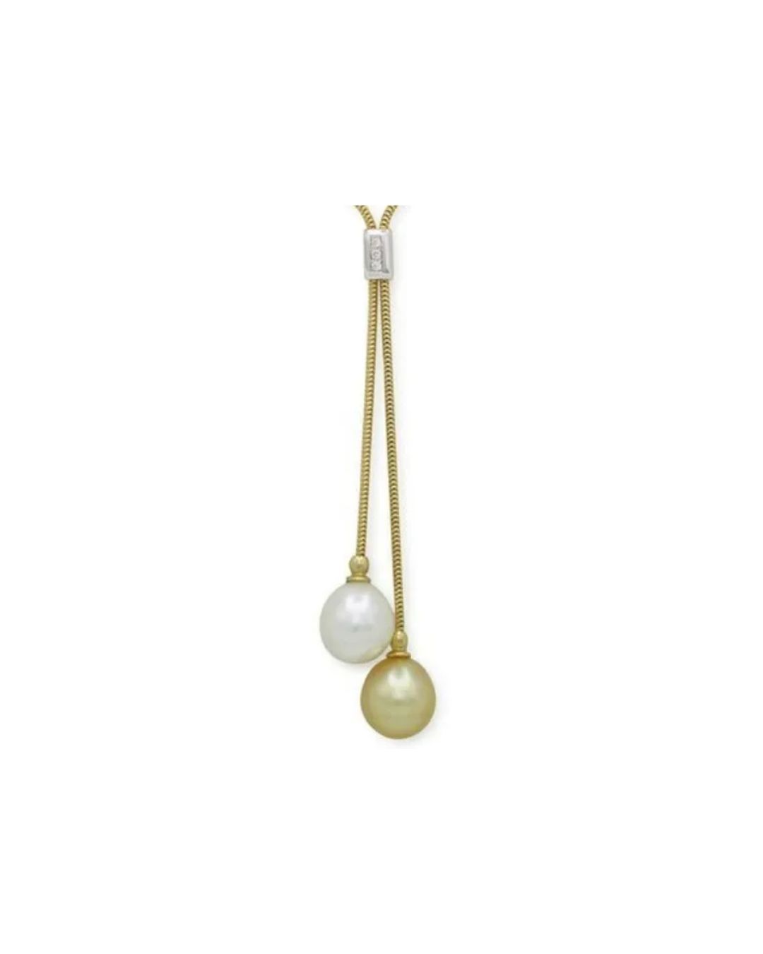A gold lariat necklace featuring a white pearl and a golden pearl suspended from a sliding silver clasp.
