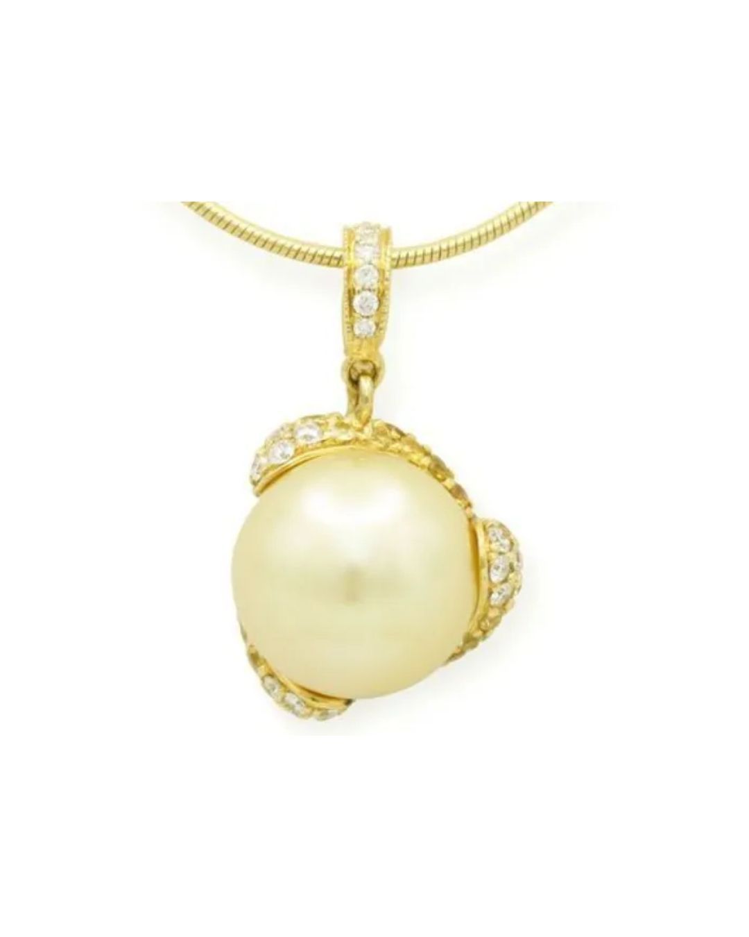 A large cream-colored pearl pendant set in gold with diamond accents, hanging from a thin gold chain.
