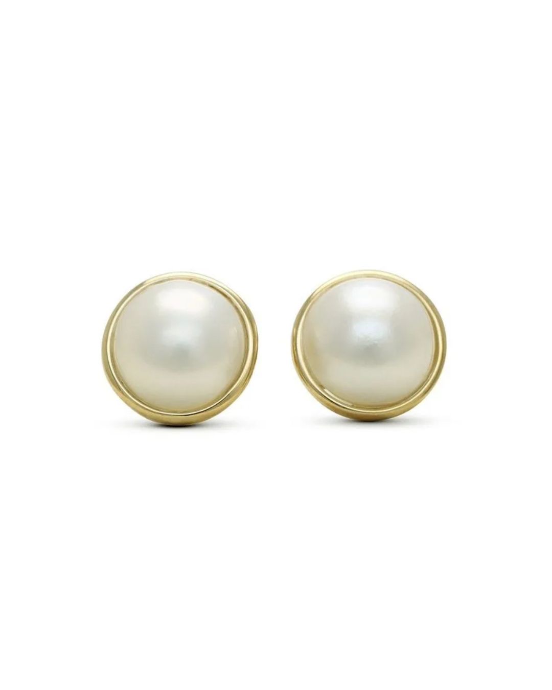 A pair of white pearl stud earrings set in polished yellow gold, displayed against a plain white background.