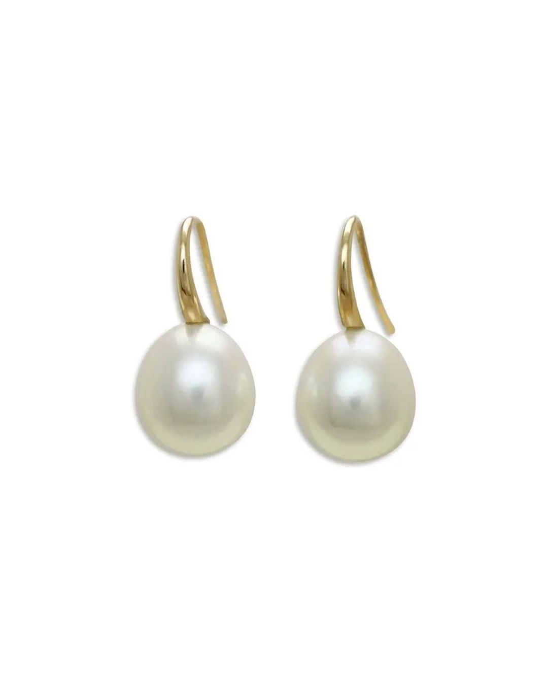 A pair of lustrous white pearl drop earrings with gold curved hooks against a plain white background.
