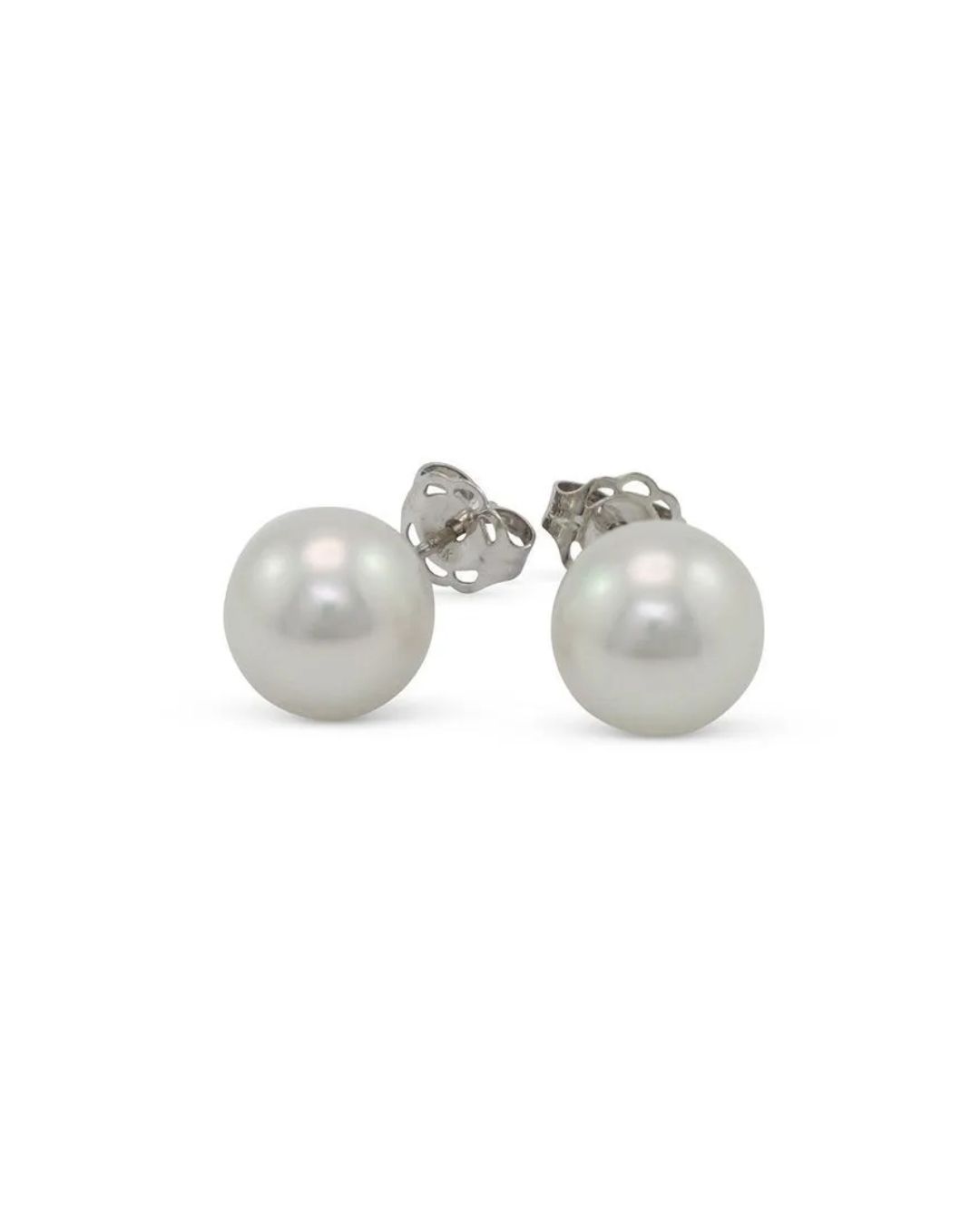 A pair of white pearl stud earrings with silver-toned metal posts and butterfly backs against a white background.