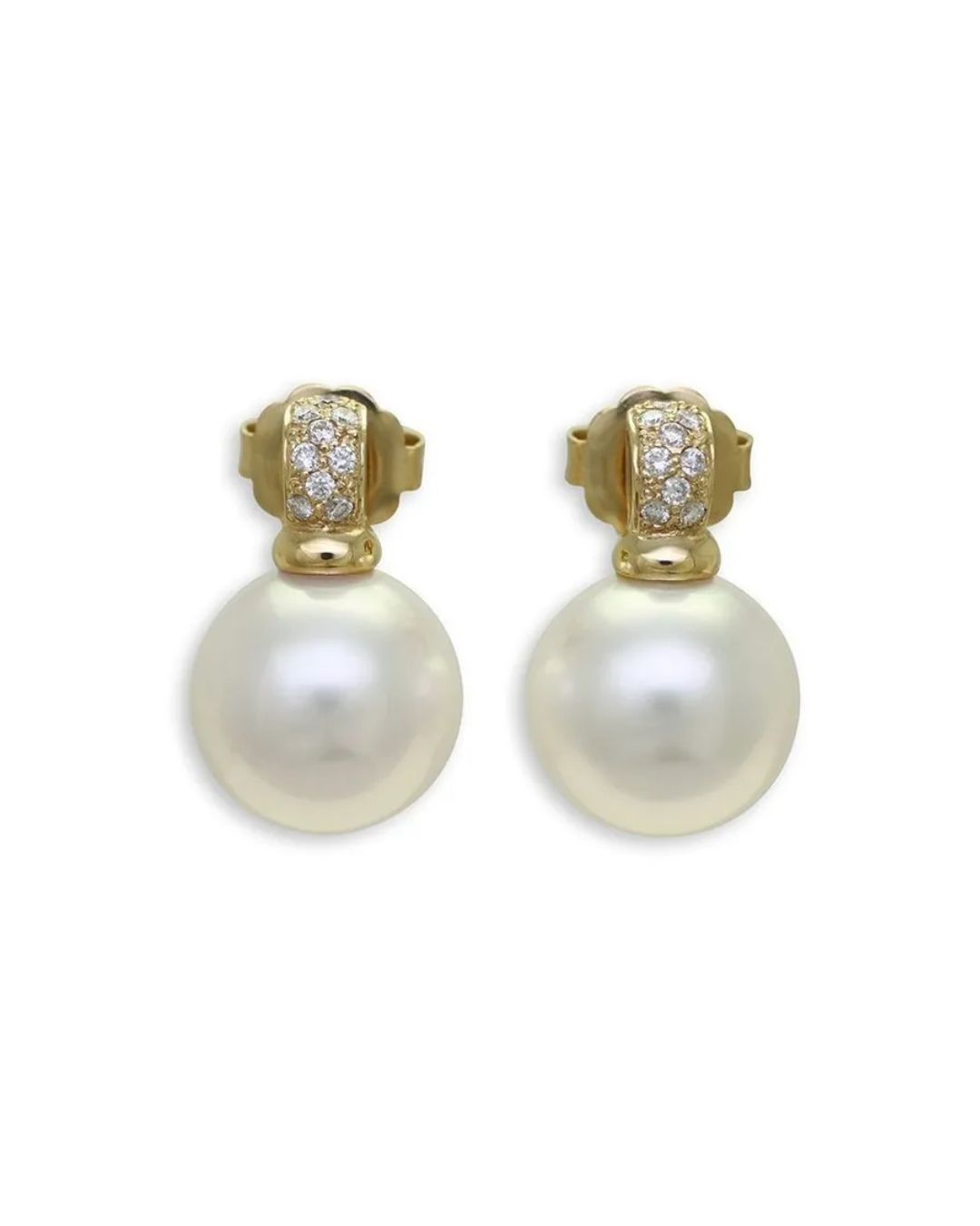 A pair of gold earrings featuring a white pearl drop suspended from a small, diamond-encrusted gold post.