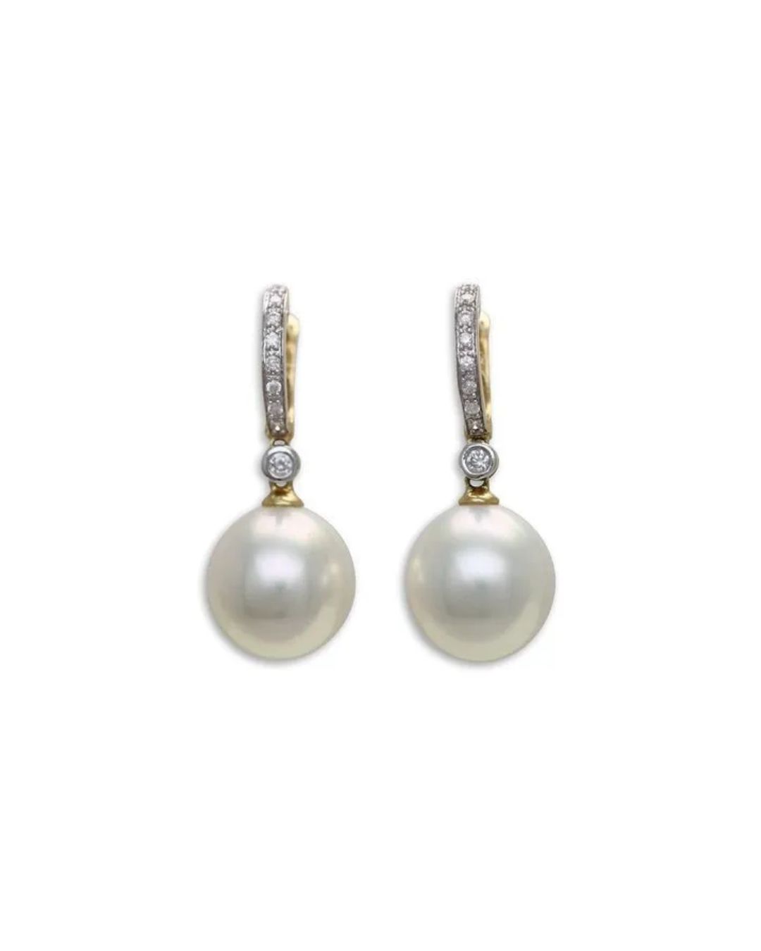 A pair of gold earrings featuring small diamond-encrusted hoops and a large, round white pearl drop.