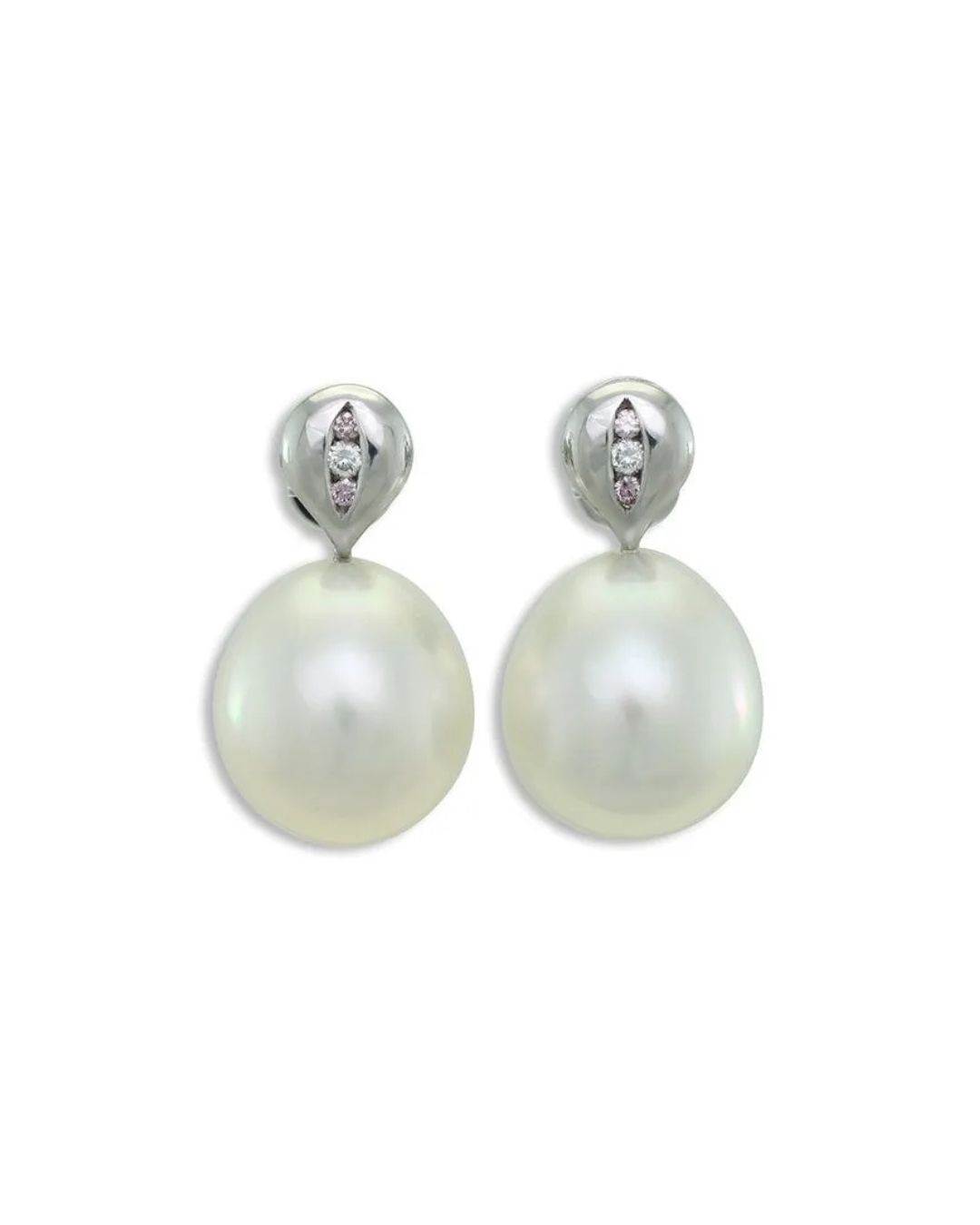 A pair of elegant earrings featuring large, white, drop-shaped pearls suspended from polished silver settings with diamonds.