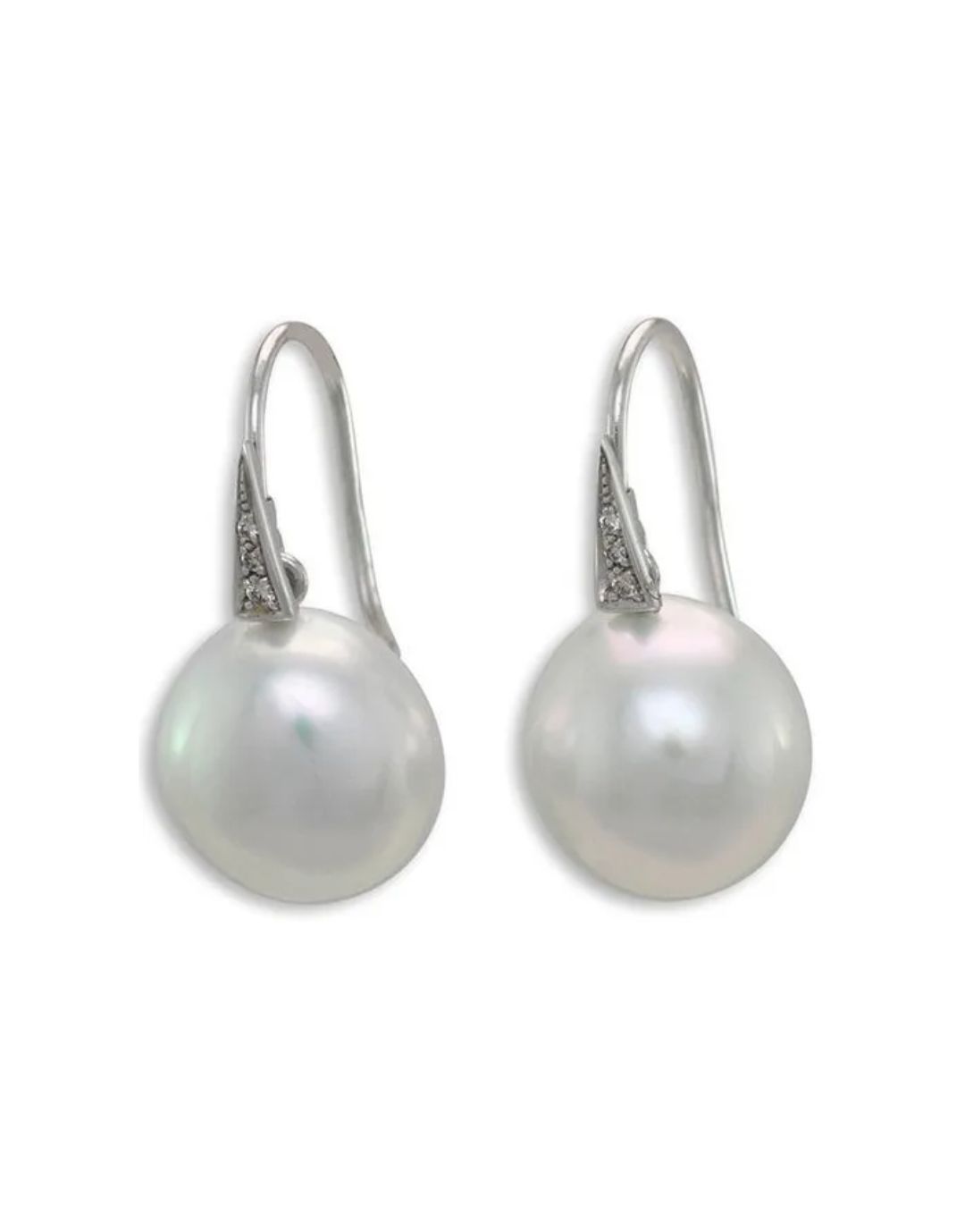 A pair of white, round pearl drop earrings with silver hooks and small diamond accents against a white background.