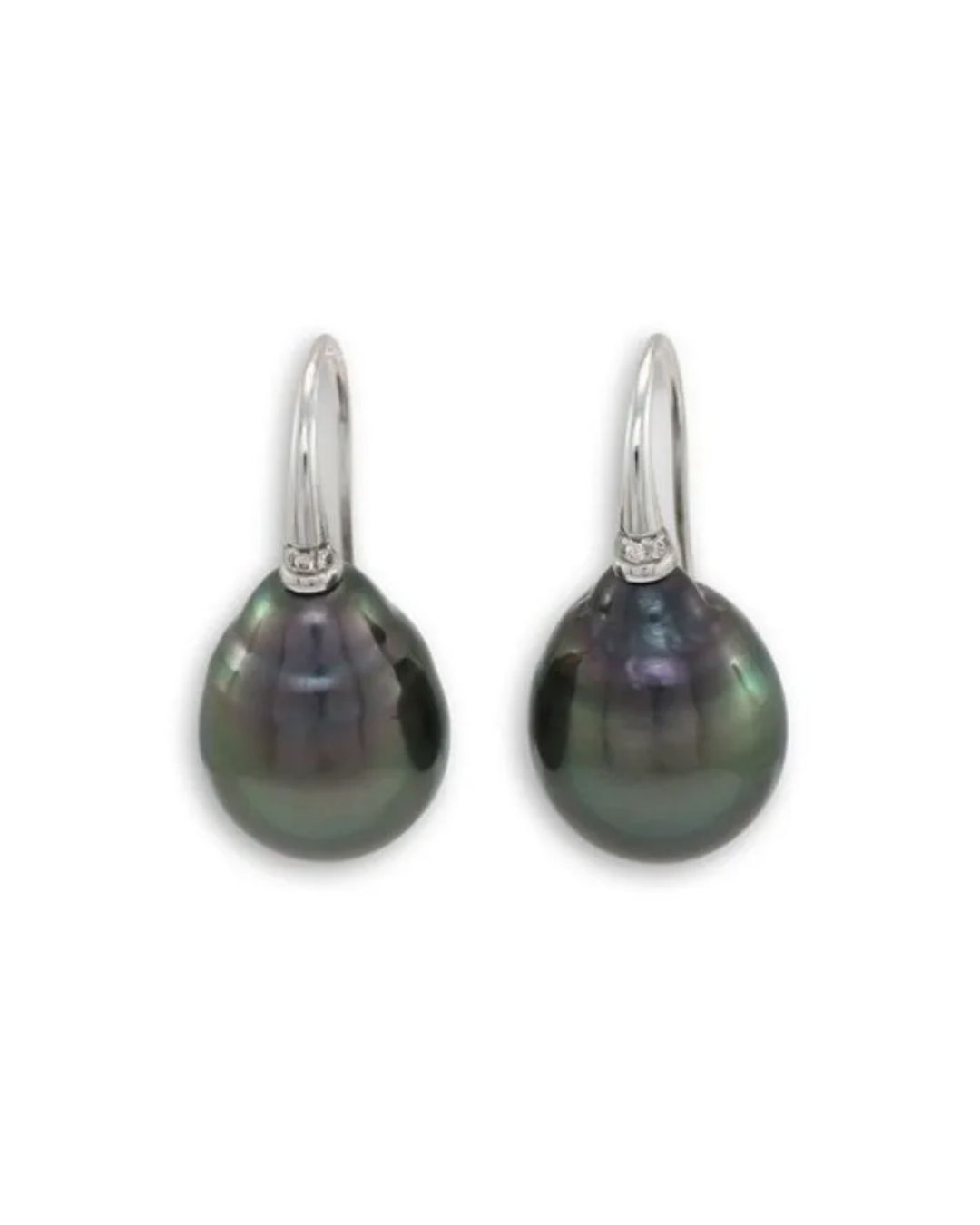 A pair of drop-shaped dark iridescent pearls hanging from simple silver curved ear hooks against a white background.