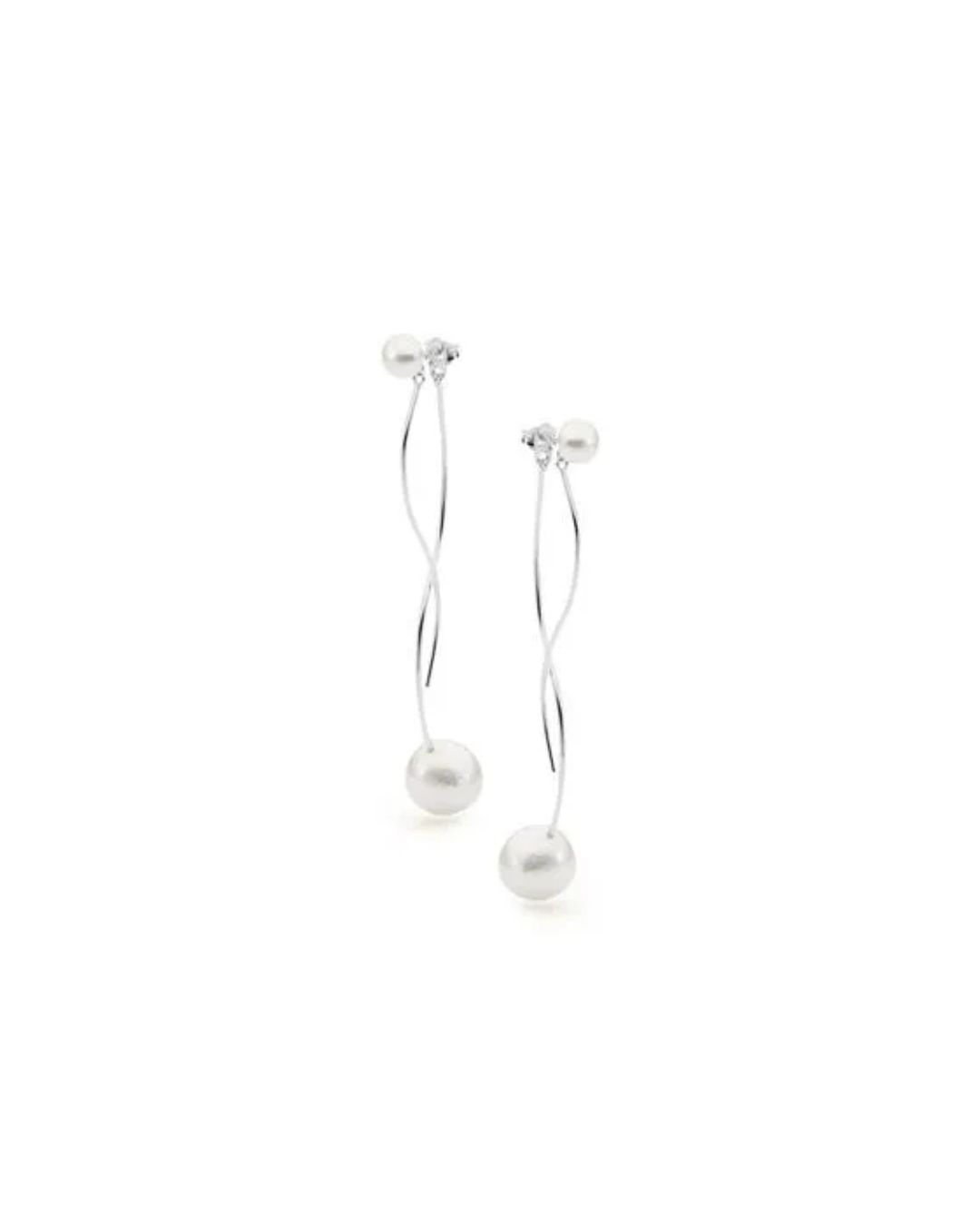 Two long, silver-toned threader earrings featuring small pearl studs at the top and larger dangling pearls at the ends.