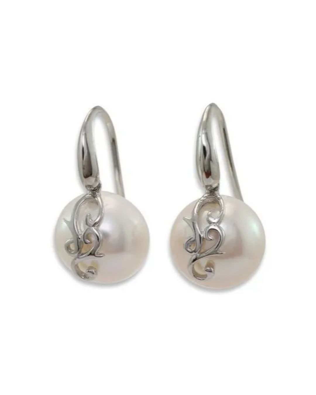 A pair of silver drop earrings featuring a round, white pearl accented by ornate, decorative silver filigree.
