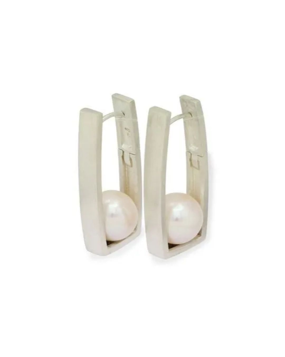 A pair of silver hoop earrings, each featuring a centered, smooth white pearl inside a rectangular metal frame.