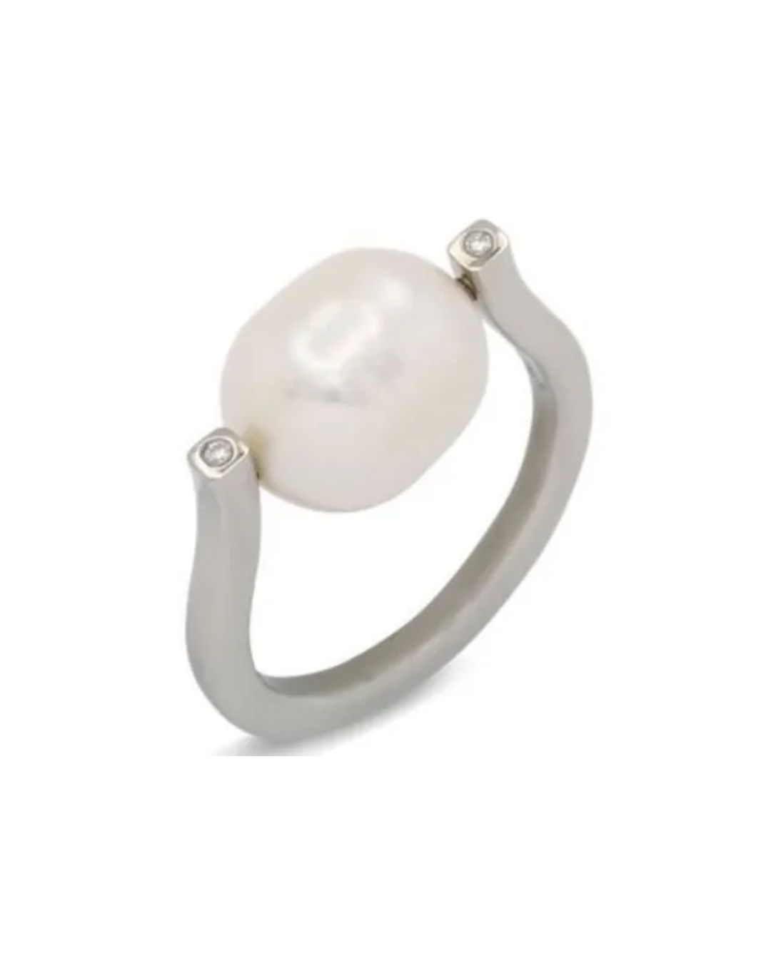 A silver ring featuring a large, oval white pearl tension-set between two small, inset diamonds on a smooth band.