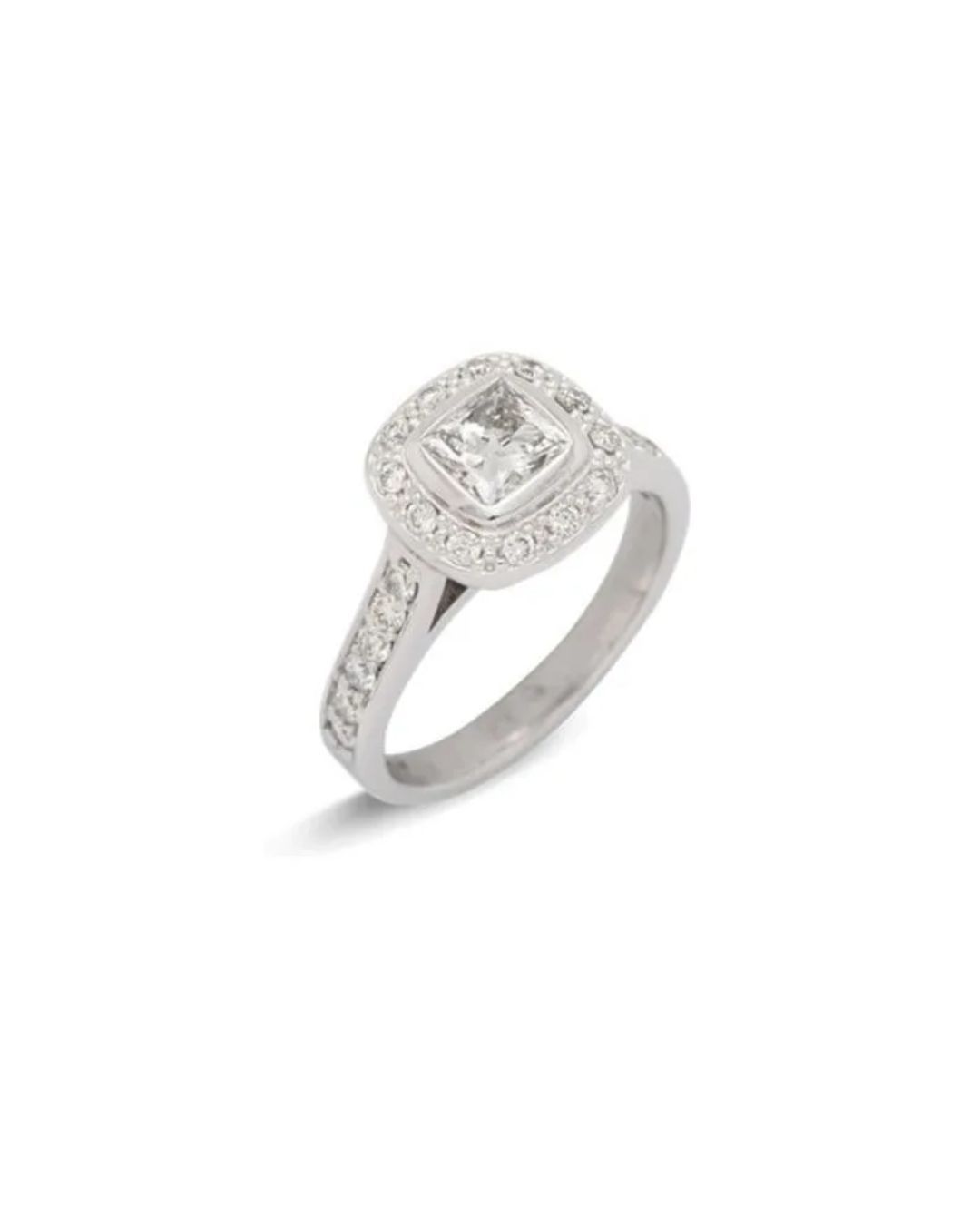 A silver-toned diamond engagement ring with a princess-cut center stone surrounded by a halo and diamond-set shoulders.