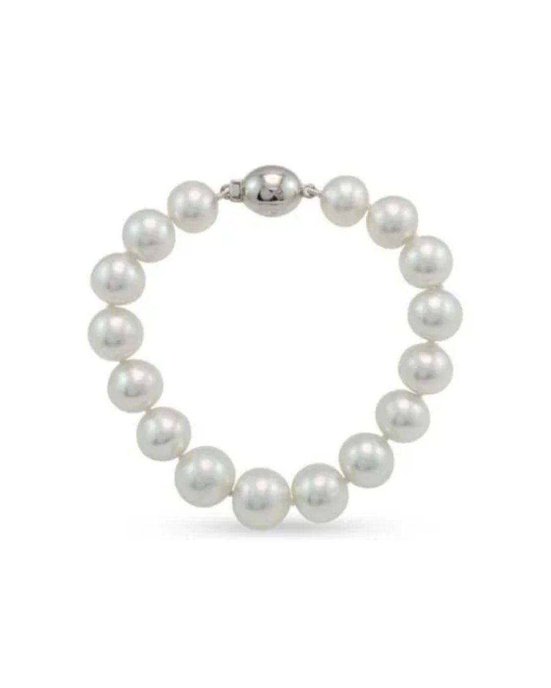 A bracelet made of luminous white pearls featuring a polished, round silver clasp against a plain white background.