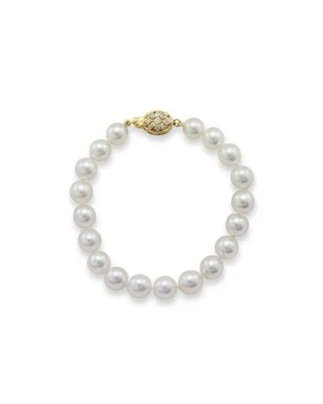 A bracelet of uniform white pearls with a decorative, diamond-encrusted gold filigree clasp against a white background.
