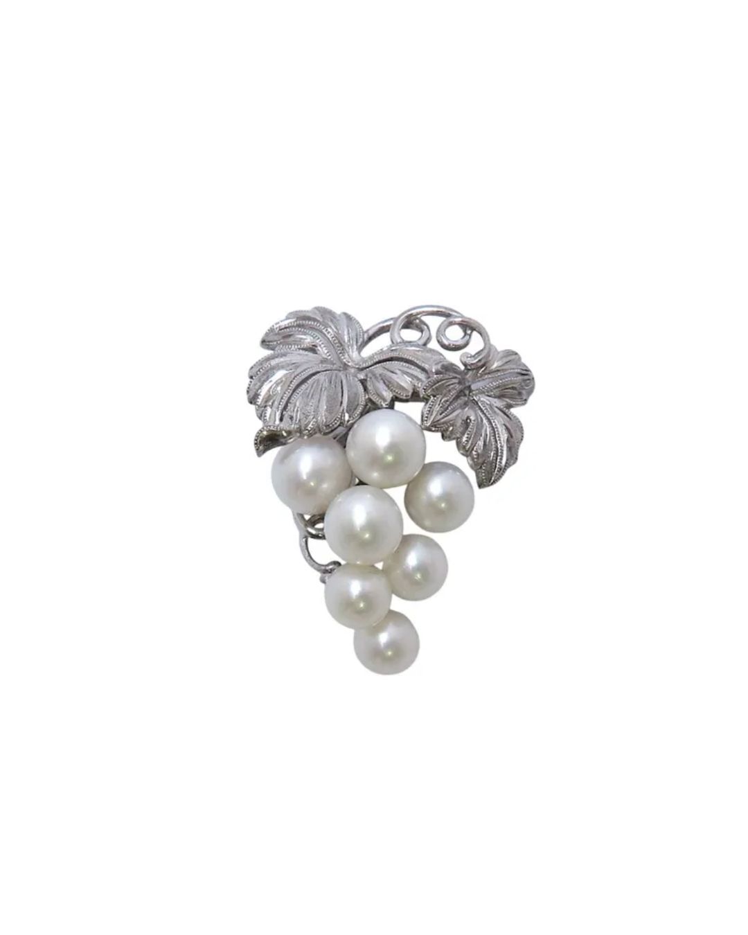 Mikimoto pearl brooch featuring cultured pearls in elegant setting