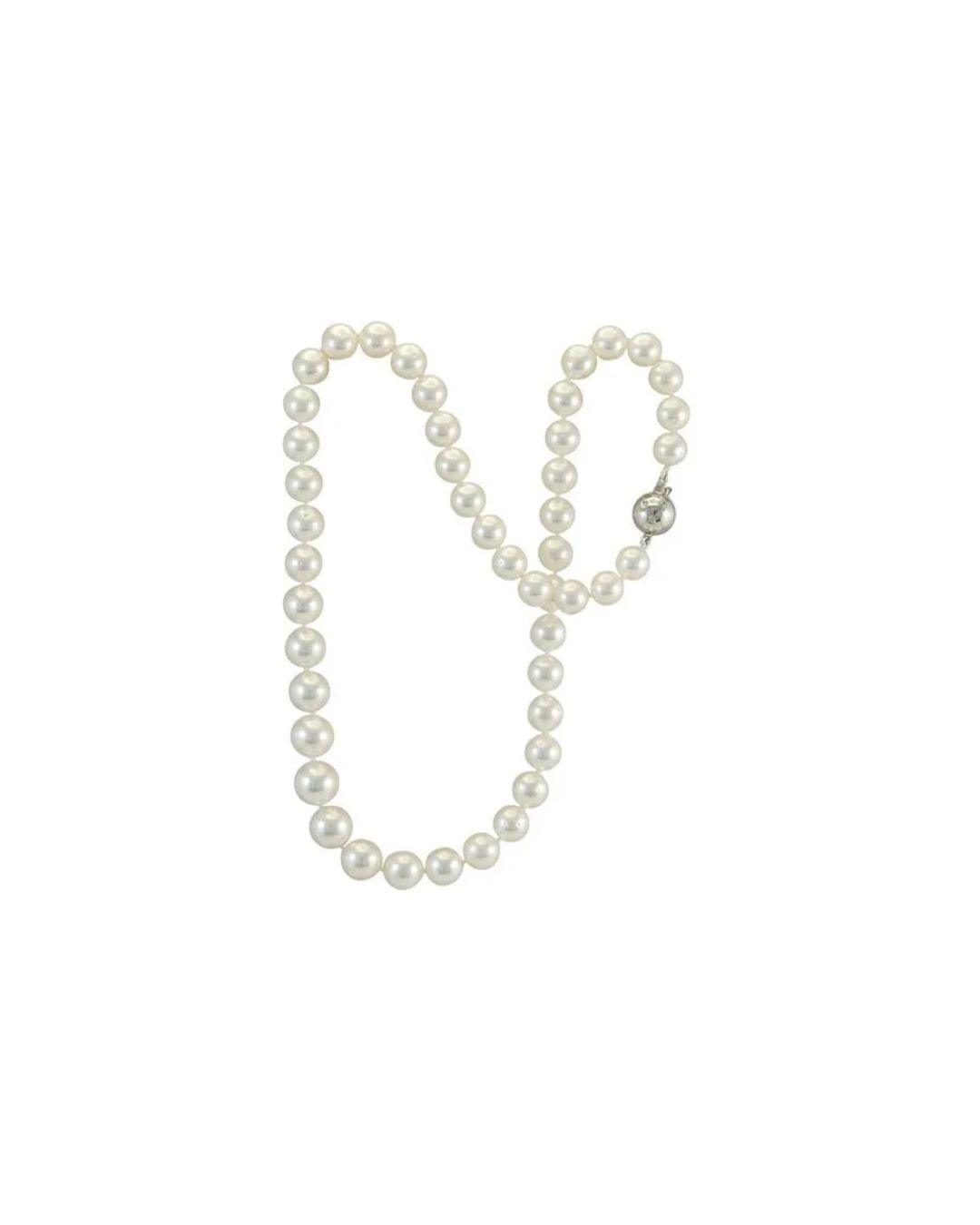 A string of white, round pearls with a silver spherical clasp, arranged in a U-shape against a plain white background.