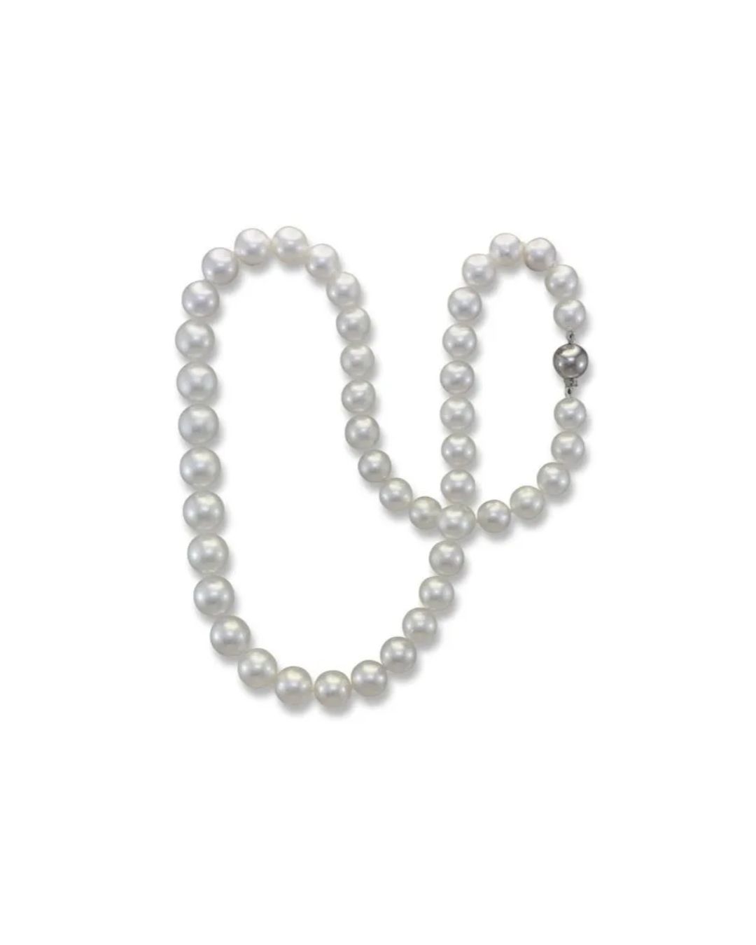 A single strand of lustrous, white spherical pearls connected by a silver clasp, arranged in a U-shape against white.