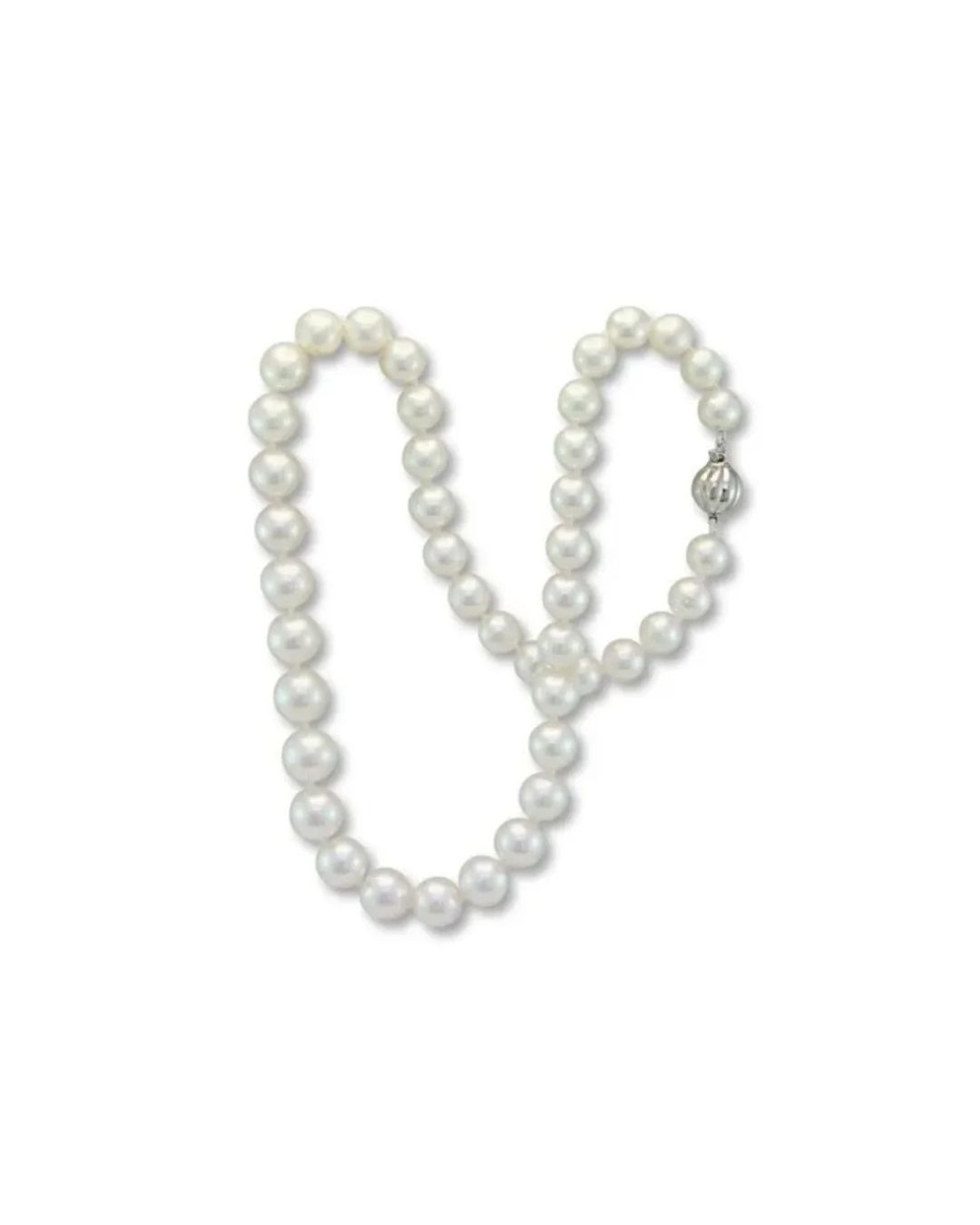 A classic white pearl necklace arranged in a looping shape, featuring a round, silver-toned ridged clasp.