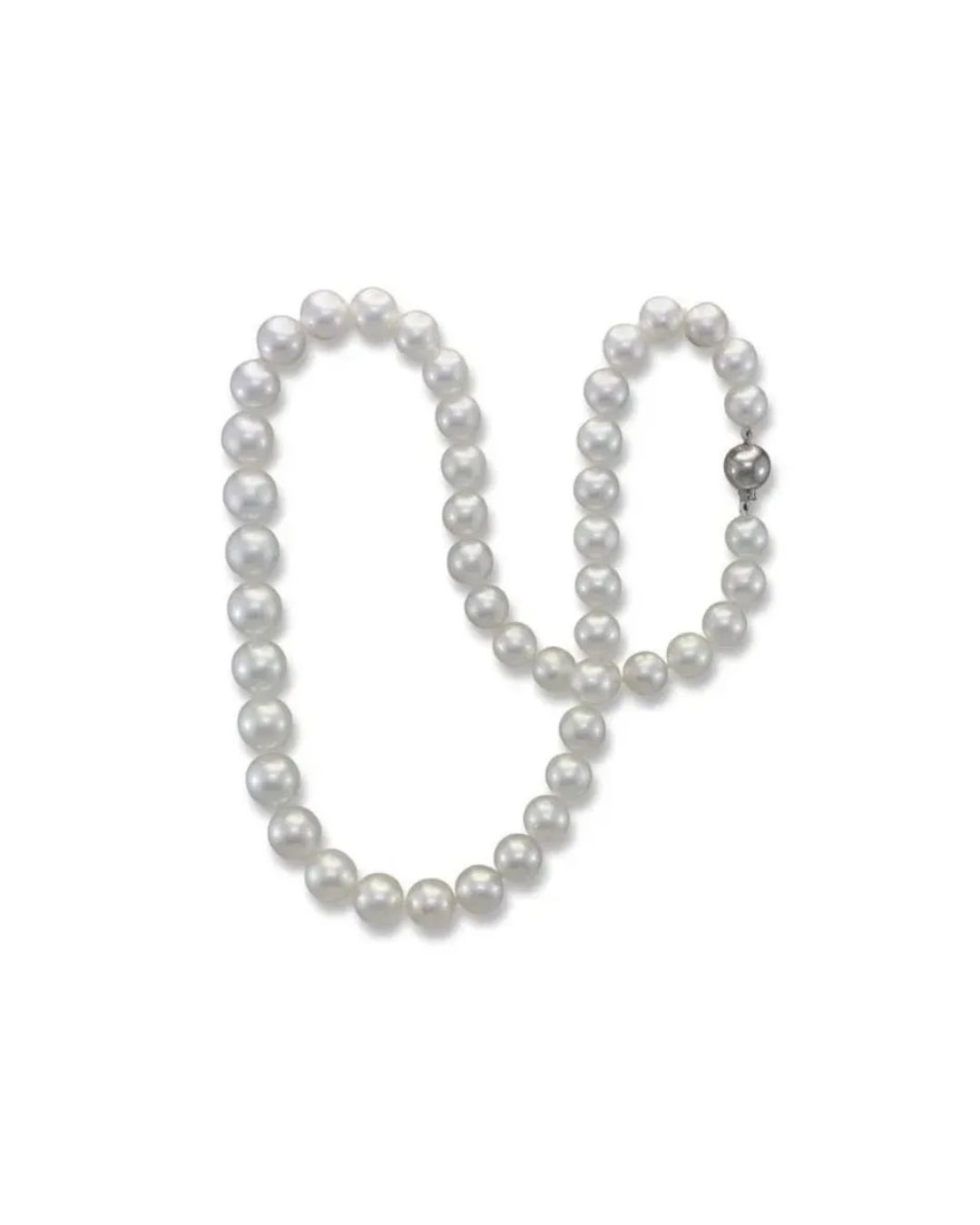 A string of smooth, round white pearls arranged in a loop with a silver clasp against a plain white background.