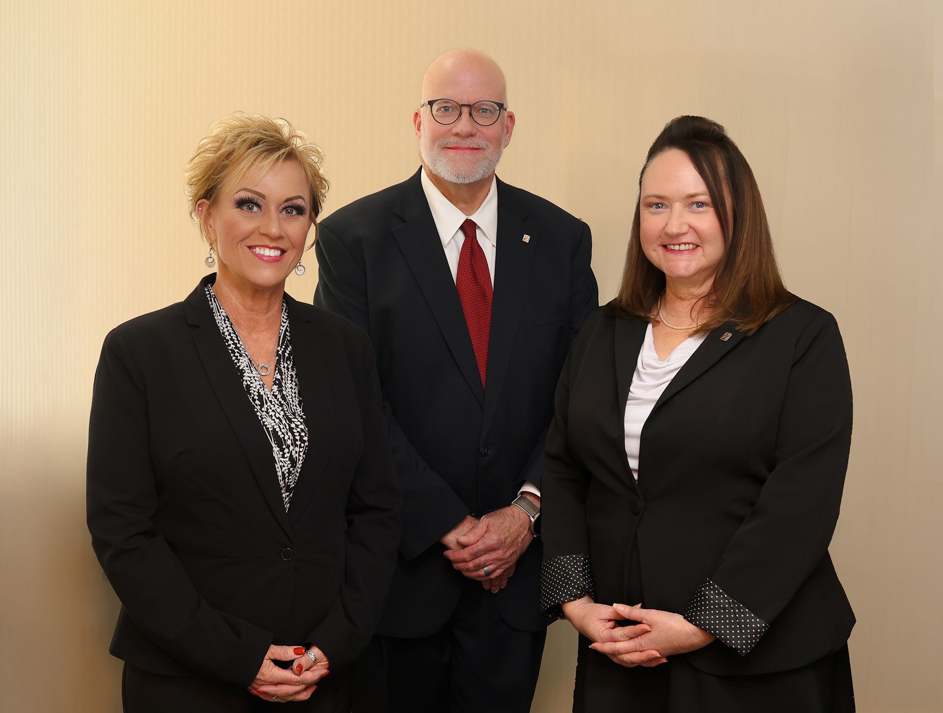 a group of people standing next to each other with a sticker that says 98 % family satisfaction