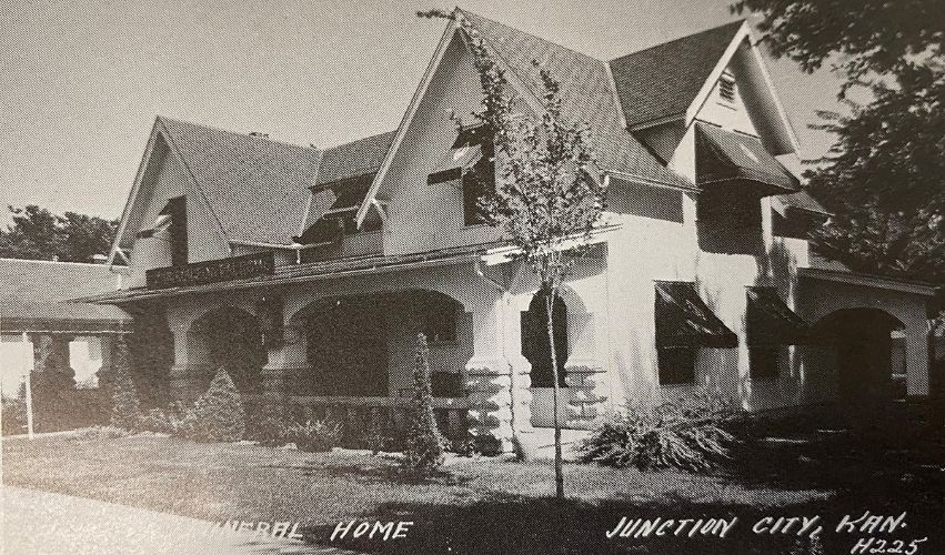 A black and white photo of a house in junction city