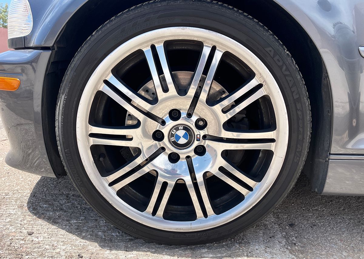 Silver and black BMW car wheel with the BMW logo | Chet's Wheel Alignment