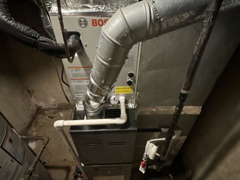A bosch air conditioner is installed in a basement.