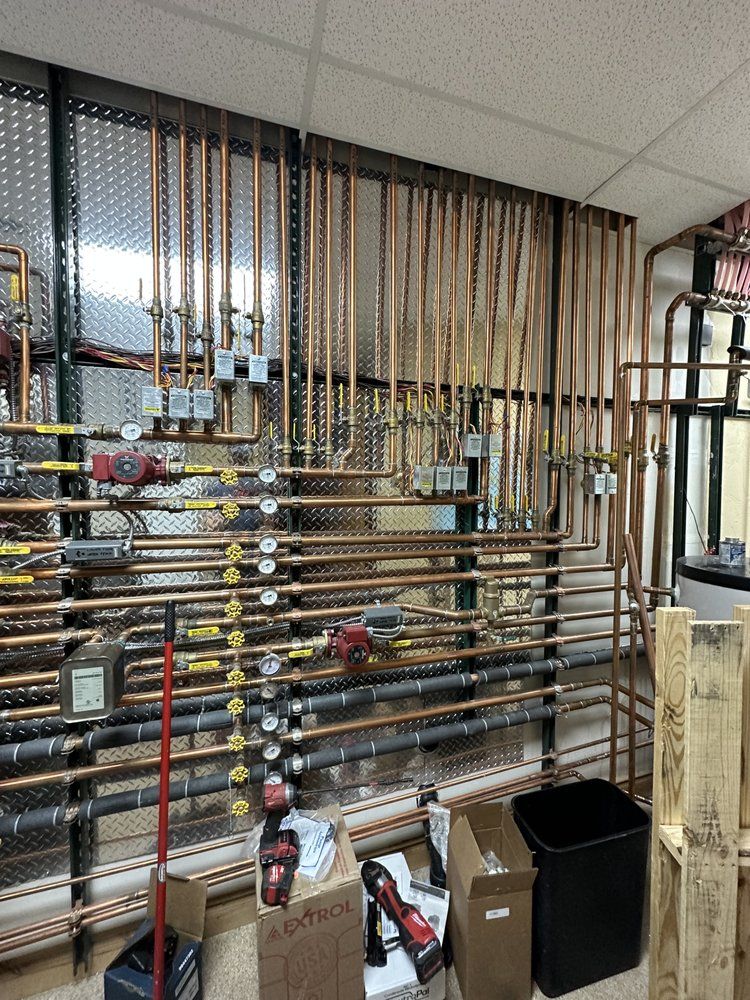 A room filled with lots of pipes and boxes.