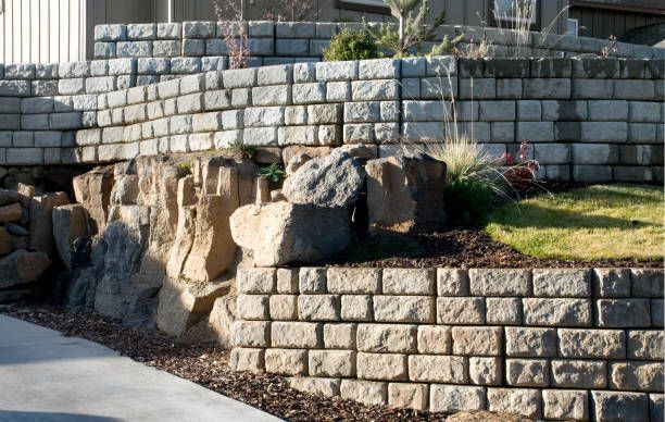 A brick wall with a lot of rocks on it