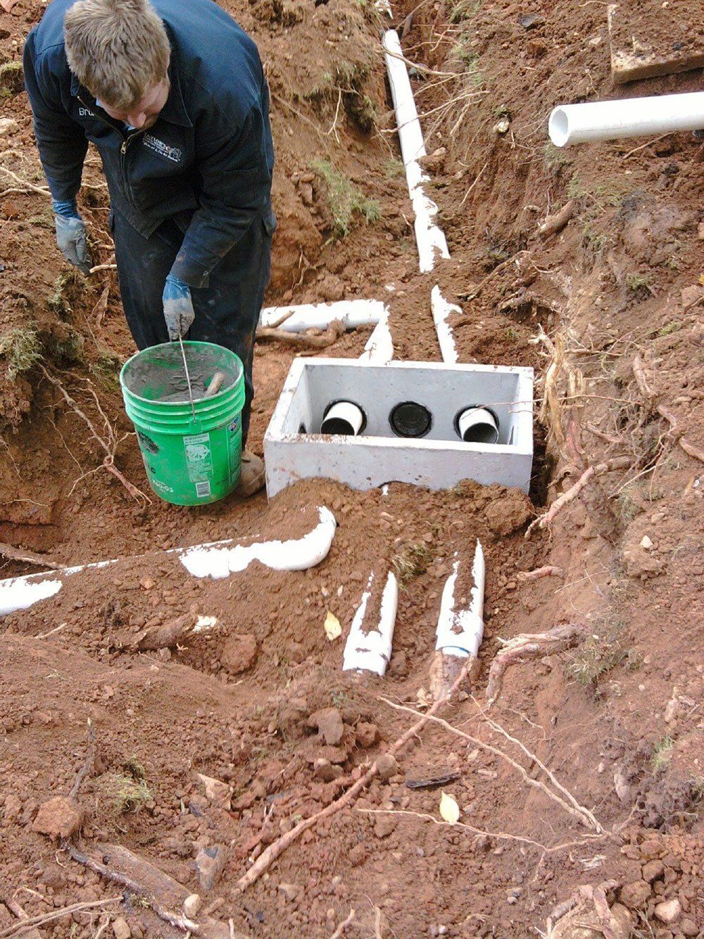 Man Working on Septic Installation — Appomattox, VA — Taylor’s Septic Service Inc