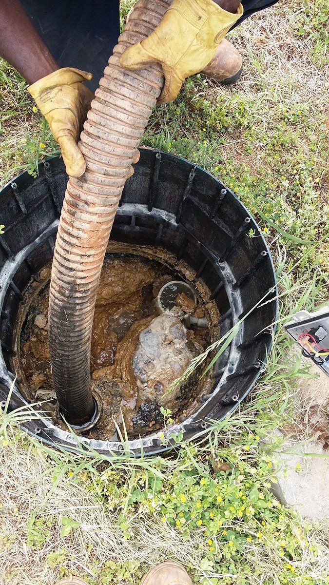 Worker Cleaning the Septic Tank — Appomattox, VA — Taylor’s Septic Service Inc