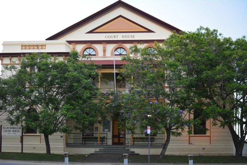A Court House With Trees in Front of It — MDK Mini Excavator - Dingo & Tipper Hire in Maryborough, QLD