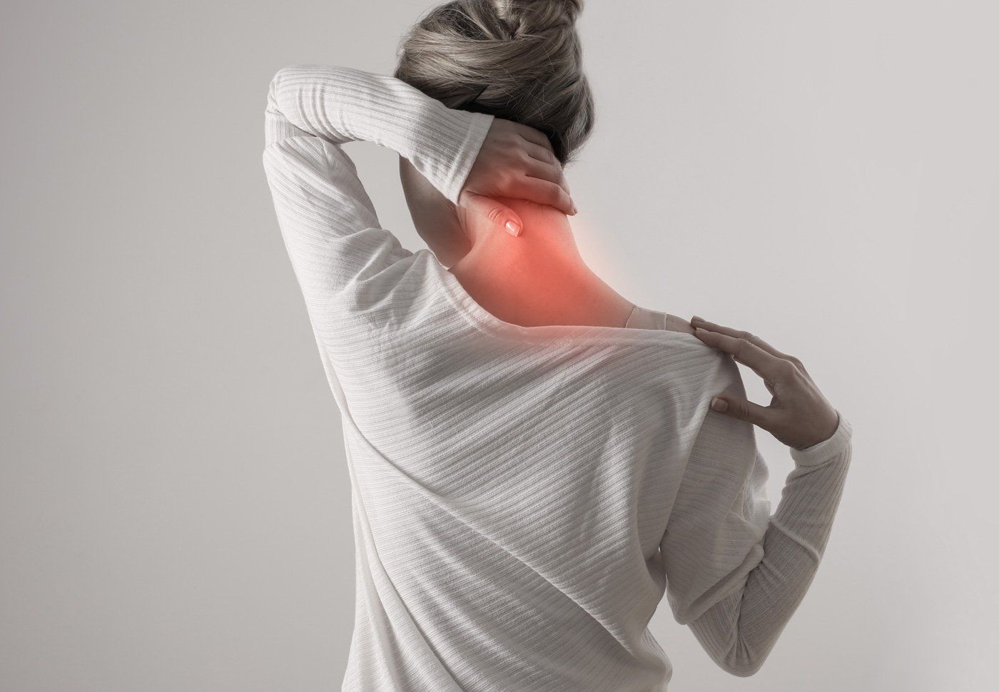 Woman Holding To Neck – St. Augustine, FL – Pain Management Specialists