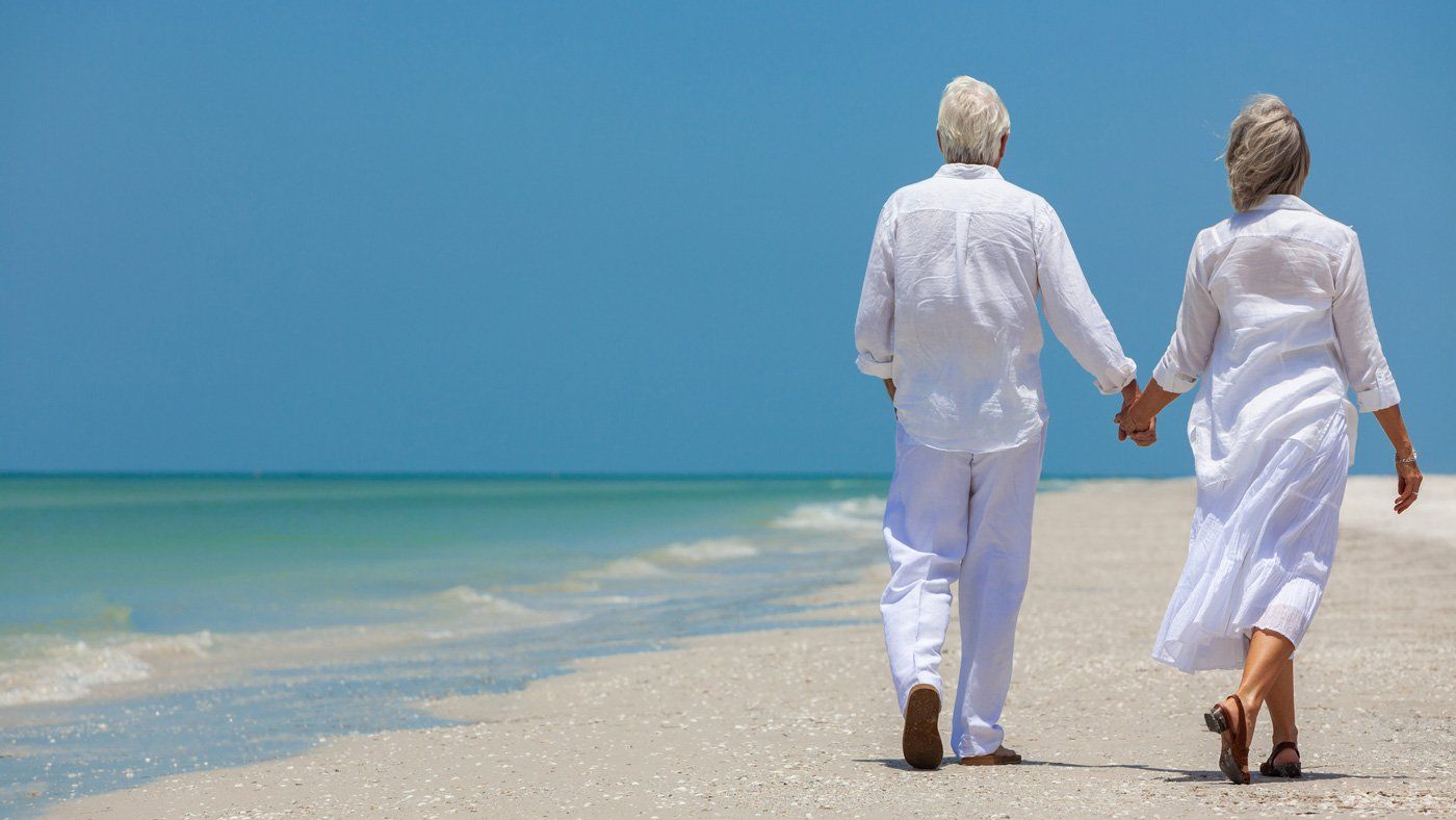 Senior Couple Walking At The Beach – St. Augustine, FL – Pain Management Specialists