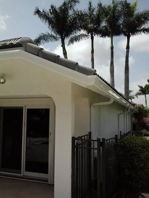 Installed Gutter On Clean White House — Oakland Park, FL — Watertite Gutter Company