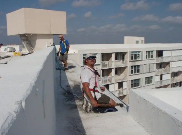 Two Men Working On The Roof — Oakland Park, FL — Watertite Gutter Company