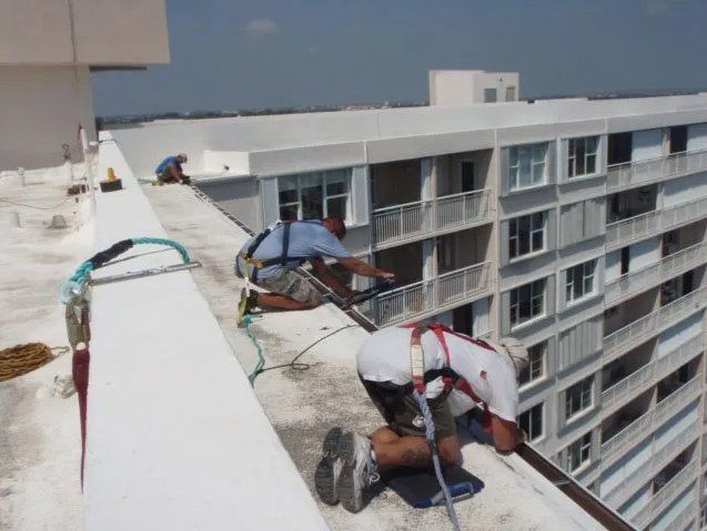 Man Installing Commercial Gutter — Oakland Park, FL — Watertite Gutter Company