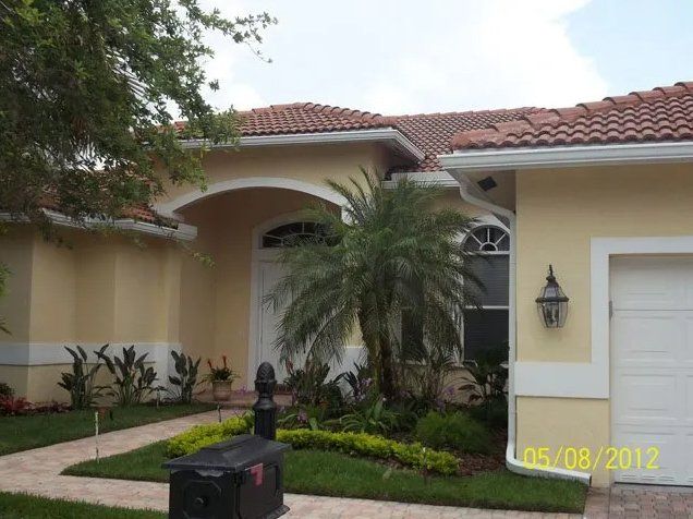 Yellow House — Oakland Park, FL — Watertite Gutter Company