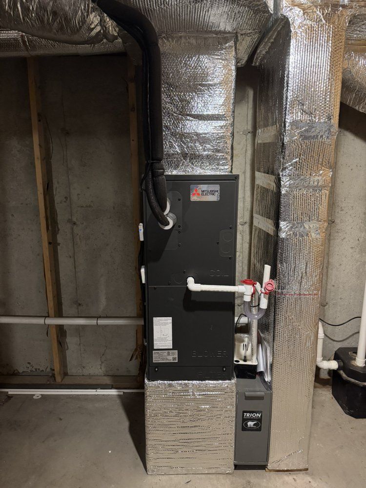A heating pump is installed in a basement in Quincy MA.