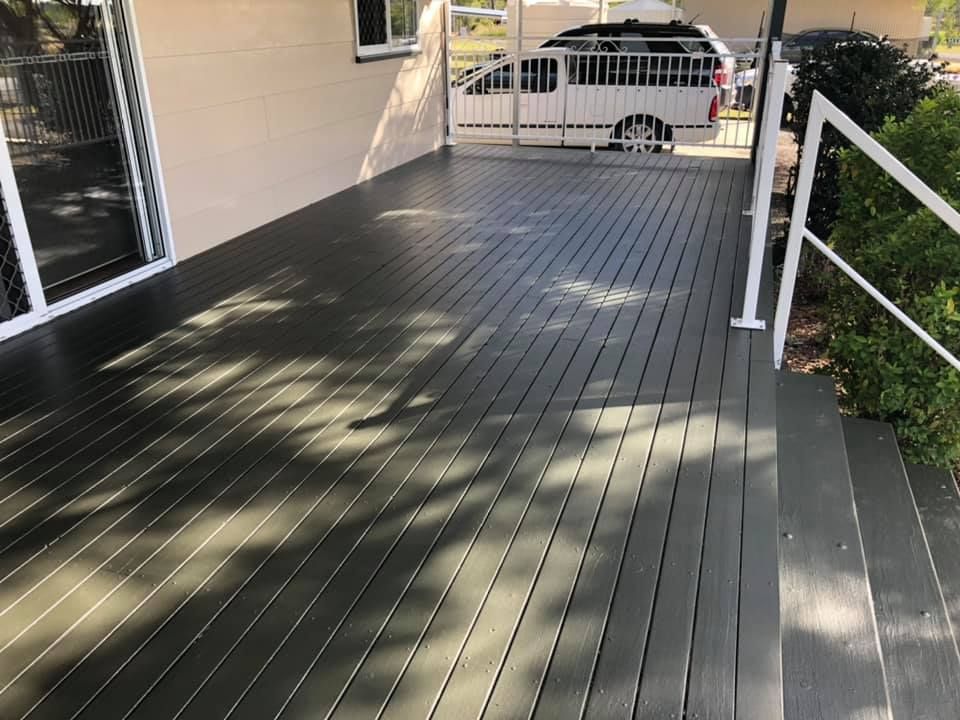 Green Deck With White Railings, Steps, and House Exterior — Allman's Painting in Noosa, QLD